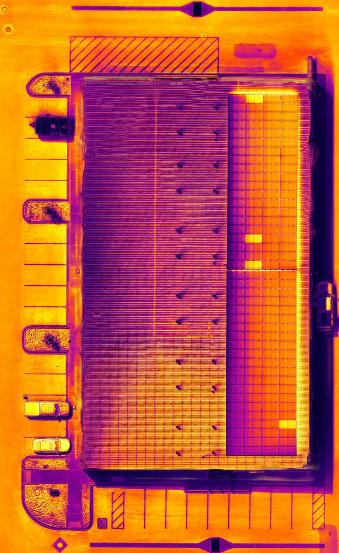 Vanguard thermal orthomosaic of the same facility roof and solar array, rotated to show temperature anomalies